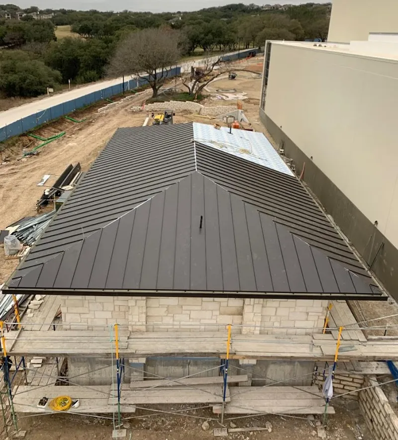 Metal roof new construction with scaffolding in Griffin